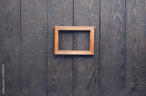 photo frame on old wooden wall