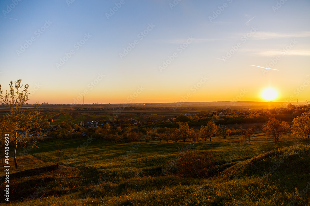 beautiful sunset over a field in rural country Romania