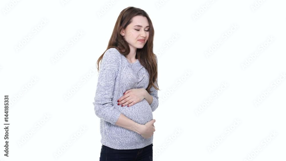 Tired worried pregnant woman touching her belly and feeling exhausted isolated over white Tired worried pregnant woman touching her belly and feeling exhausted isolated over white