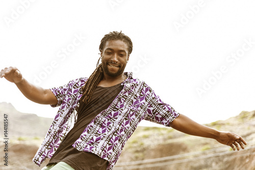 Young man skateboarding outdoors photo