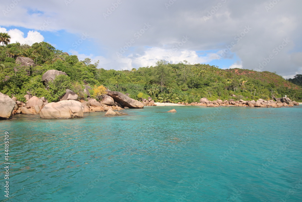 Beach close Anse Lazio, Praslin Island, Seychelles, Indian Ocean, Africa / The beautiful white sandy beach is bordered by large red granite rocks. 