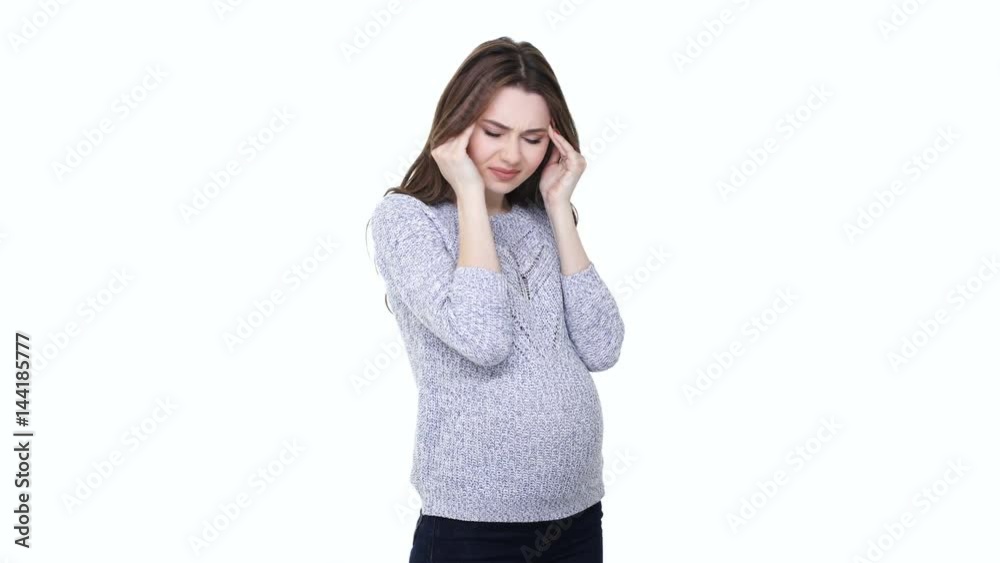 Stressed young pregnant woman suffering from headache and touching her belly isolated on white Stressed young pregnant woman suffering from headache and touching her belly isolated on white