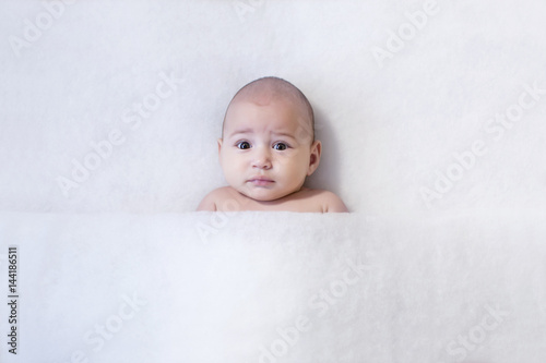 Cute baby smiling over white background