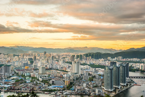 Sanya town evening cityscape  view from Luhuitou Park on Hainan Island of China.