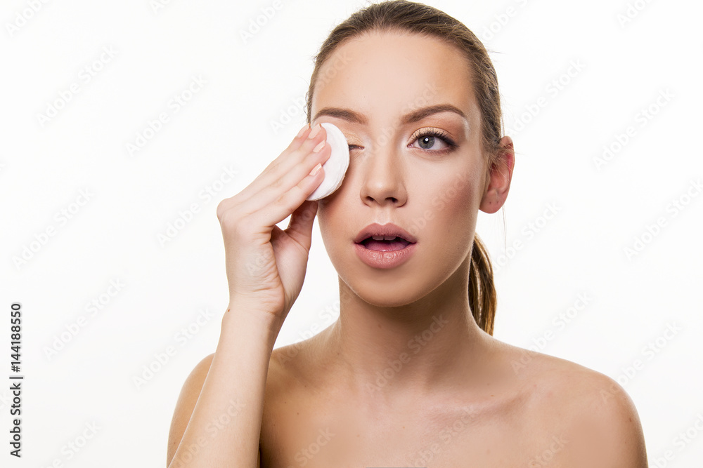 Woman remove make up with pad Woman remove make up with pad