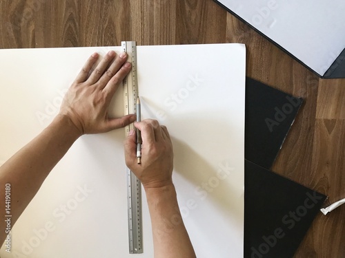 man working with paper cutting