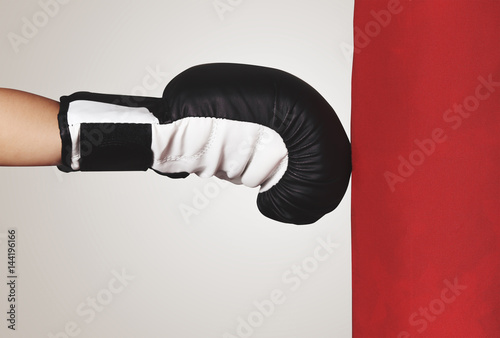 a hand of child punch red bag