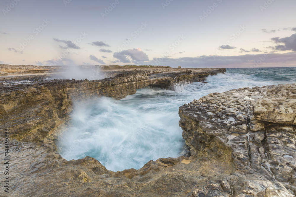 Waves of the rough sea crashing on the cliffs of Devil's Bridge Caribbean Antigua and Barbuda Leeward Islands West Indies Waves of the rough sea crashing on the cliffs of Devil's Bridge Caribbean Antigua and Barbuda Leeward Islands West Indies