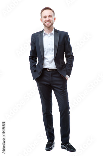 young bearded man holding hands in pockets
