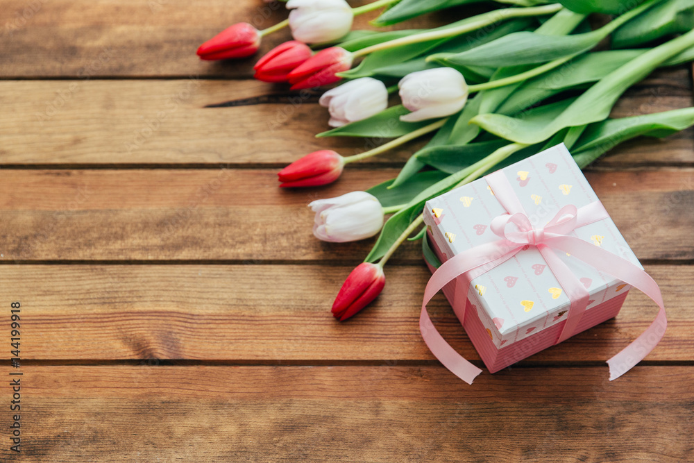 Beautiful tulips over wooden background. Mothers day concept 