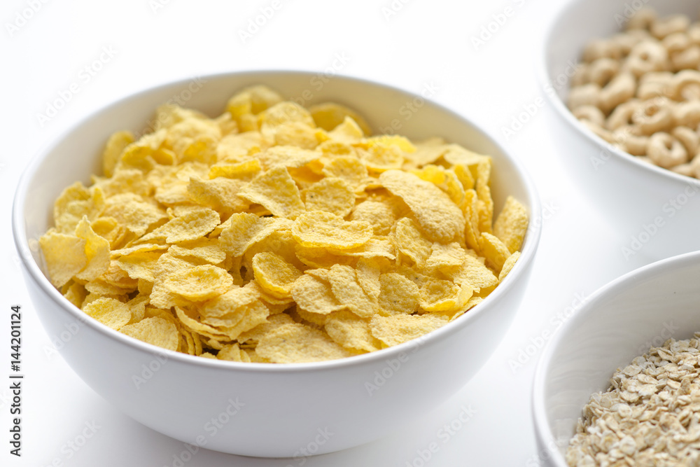 Bowl of cornflakes on white background Bowl of cornflakes on white background