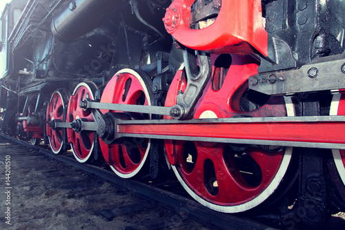 retro steam train with large red wheels