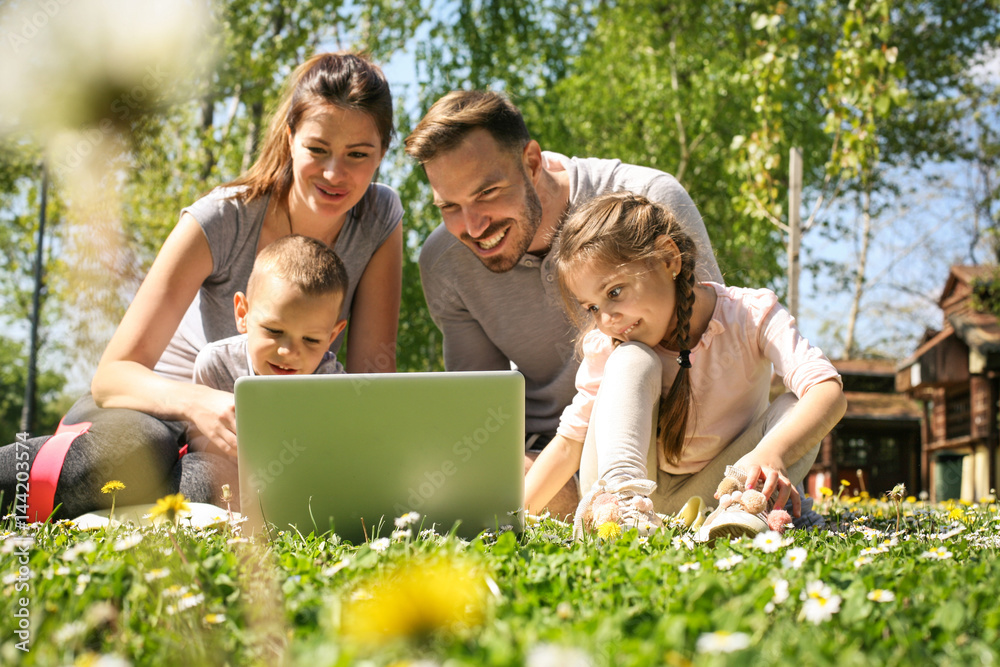 Fototapeta premium Family using laptop.