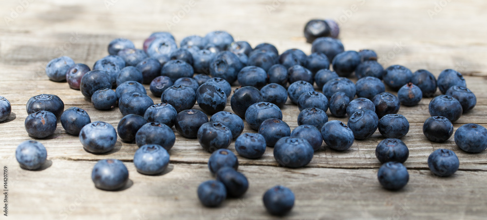 Blueberry on wooden table background. Ripe and juicy fresh picked blueberries closeup. Berries closeup Blueberry on wooden table background. Ripe and juicy fresh picked blueberries closeup. Berries closeup