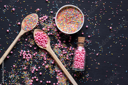 Sugar sprinkles on a black background