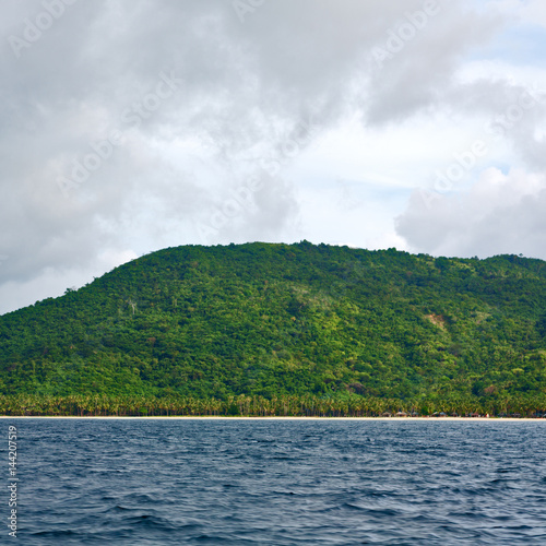 from a boat in beautiful panorama coastline sea and rock