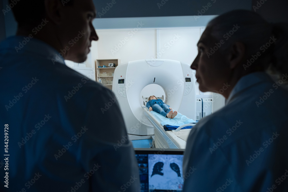 Beautiful young woman lying in the MRI scanner Beautiful young woman lying in the MRI scanner
