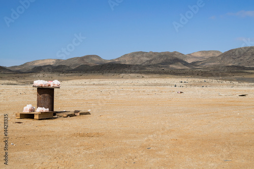 Salt for Donation in a Desert Landscape with Mountains near Swakopmund, Namibia