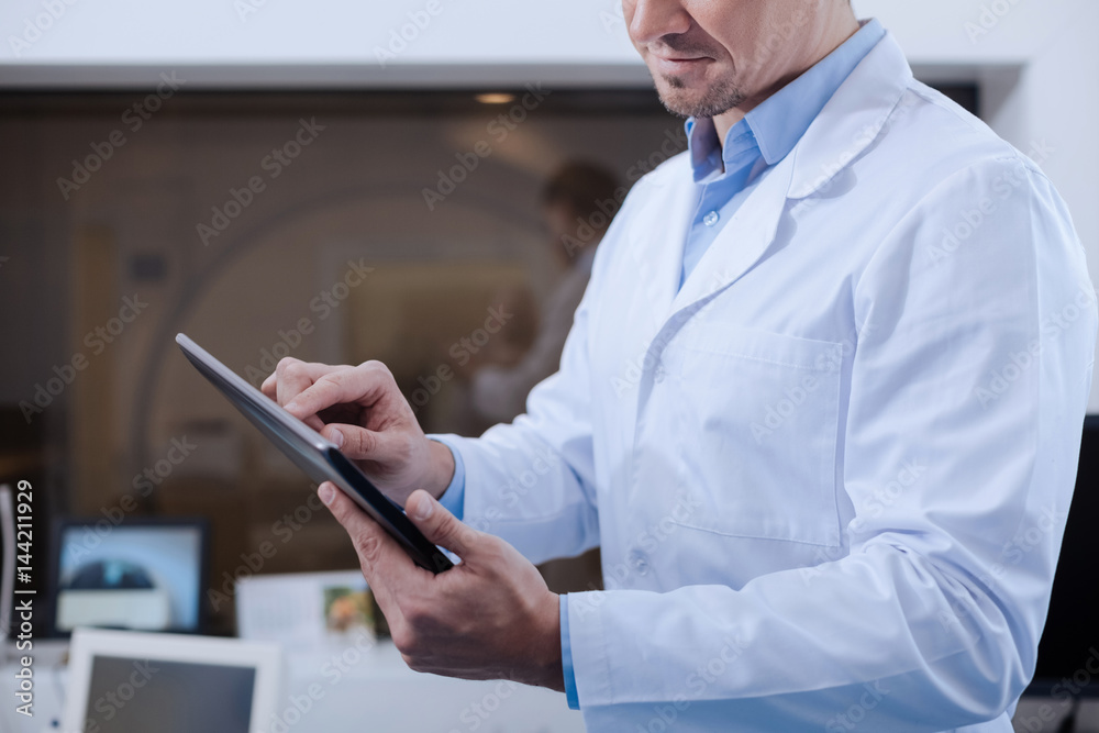 Modern tablet being used by a doctor Modern tablet being used by a doctor