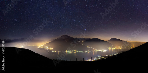 Scenic view of Lake Como against starry sky at night