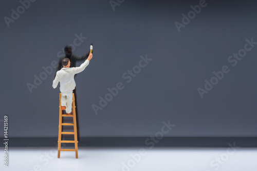 miniature people worker cleaning smart phone screen