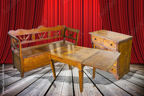 Ladies and gentlemen here is to you the old furniture just restored  - concept image with an old italian furniture on stage