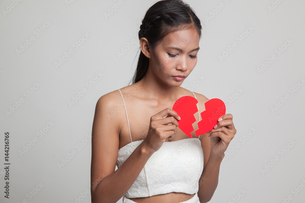 Beautiful young Asian woman with broken heart. Beautiful young Asian woman with broken heart.