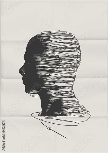The Human Mind. The shape of a man's head tangled up with threads of string - mental health concept.