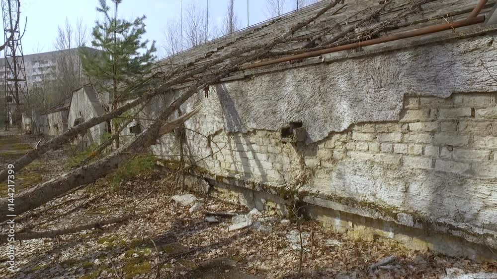Ukraine, Pripyat, 6 april 2017: Crumbling tribunes of a sports stadium in the city of Pripyat Ukraine, Pripyat, 6 april 2017: Crumbling tribunes of a sports stadium in the city of Pripyat