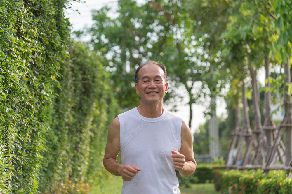 old man exercise by jogging at the park, health concept old man exercise by jogging at the park, health concept