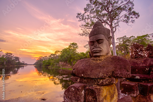 Ancient statues outside South Gate of Angkor Thom in Siem Reap, Cambodia