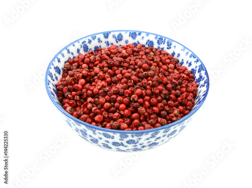 Pink peppercorns in a china bowl