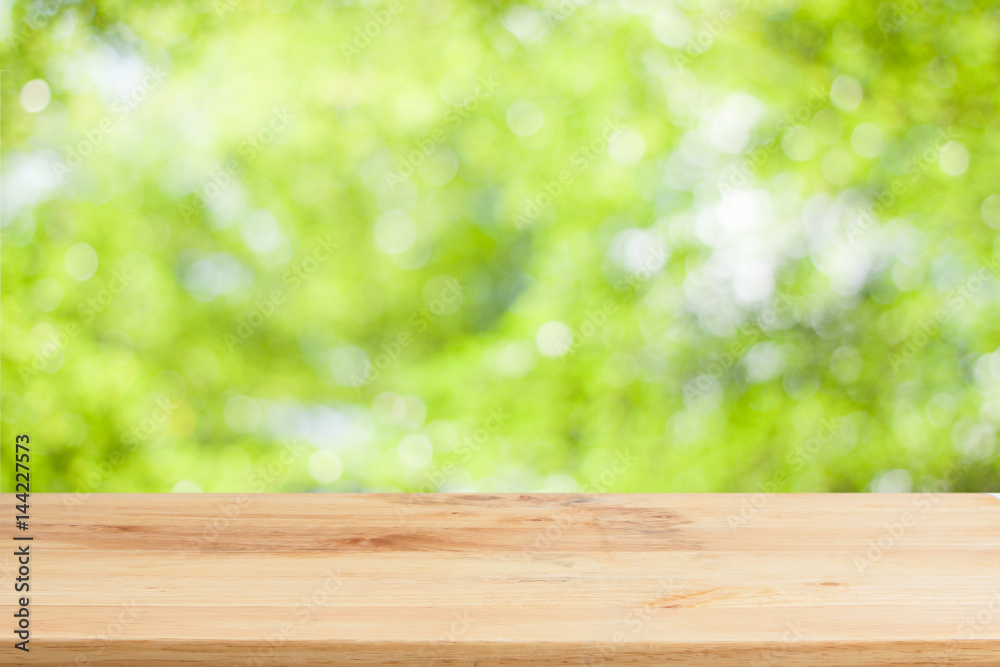 Wood table top on bokeh Green background Wood table top on bokeh Green background