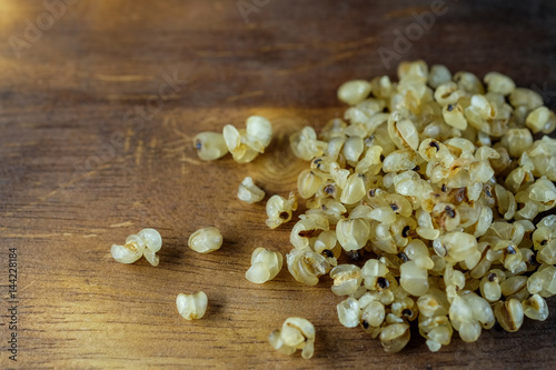 Millet on wood floor with burns.