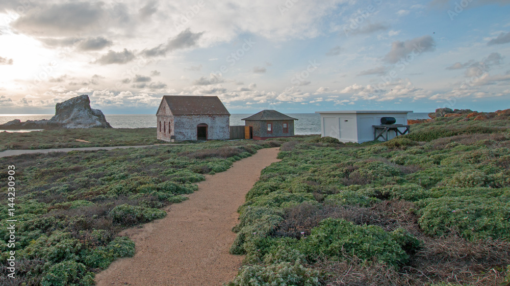 Walking path to Red Brick Fog Signal Building at Piedras Blancas Lighthouse point on the Central Coast of California USA