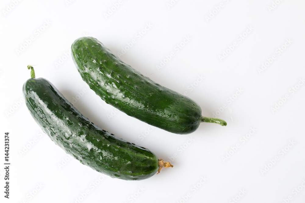 Fresh cucumbers on white wooden table Fresh cucumbers on white wooden table