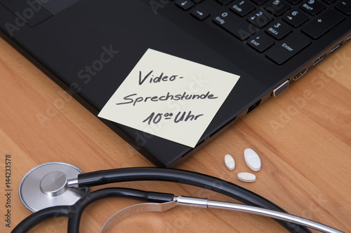 a laptop with a stethoscope in a medicine practice