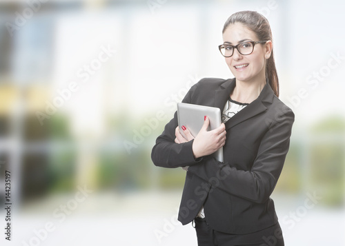 young woman holding a tablet