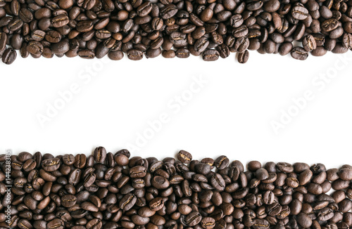 Coffee beans are arranged in a row image with copy space.