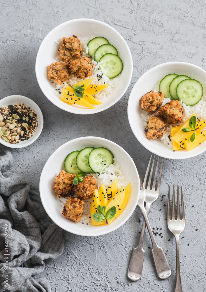 Fish chips, rice and mango on a grey background, top view. Delicious appetizer, tapas