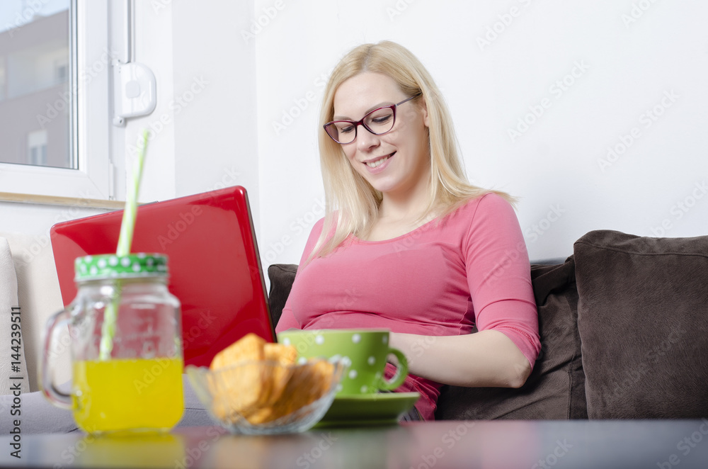 Young woman working on laptop in her home. Busines, education concept Young woman working on laptop in her home. Busines, education concept