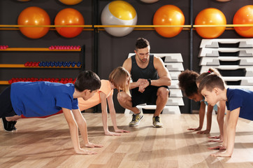 Children at physical education lesson in school gym