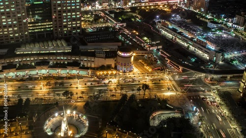 Timelapse Aerial view of building street with traffic and pedestrians in nigth. Beautiful Timelapsed of cityscape with buses, cars, motorbikes and people in Taiwan. Landmark skyscraper -Dan photo