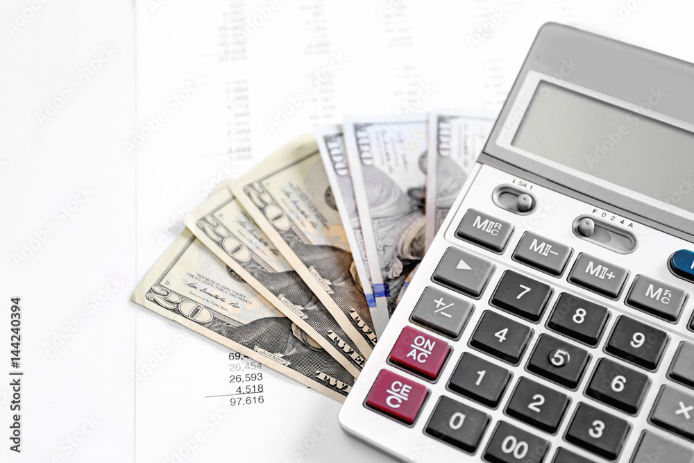 Health planning concept. Calculator and dollars on bill background Health planning concept. Calculator and dollars on bill background