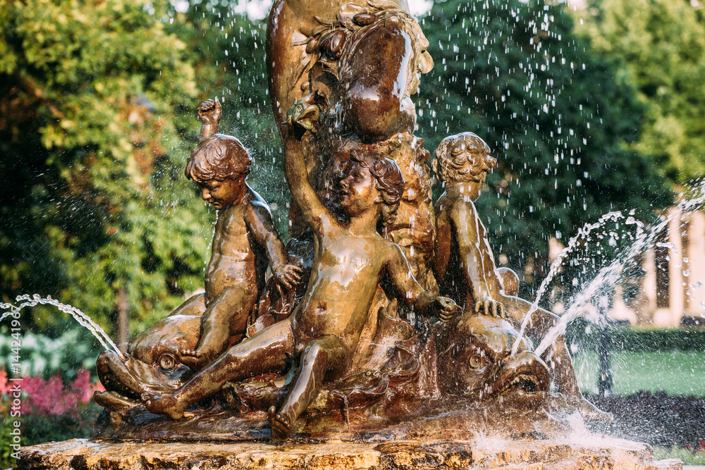 Riga, Latvia. Fountain Nymph In Water Splashes In Aspazijas Boulevard