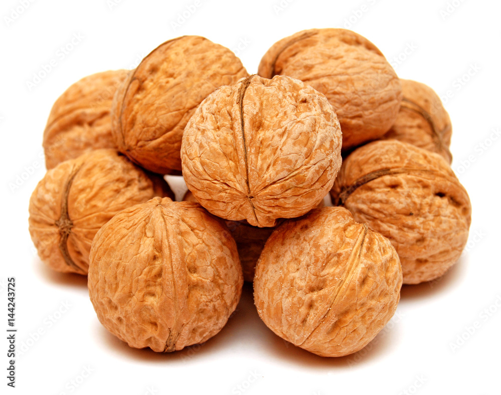 Dry walnuts in shell isolated on white background. Flat lay, top view Dry walnuts in shell isolated on white background. Flat lay, top view