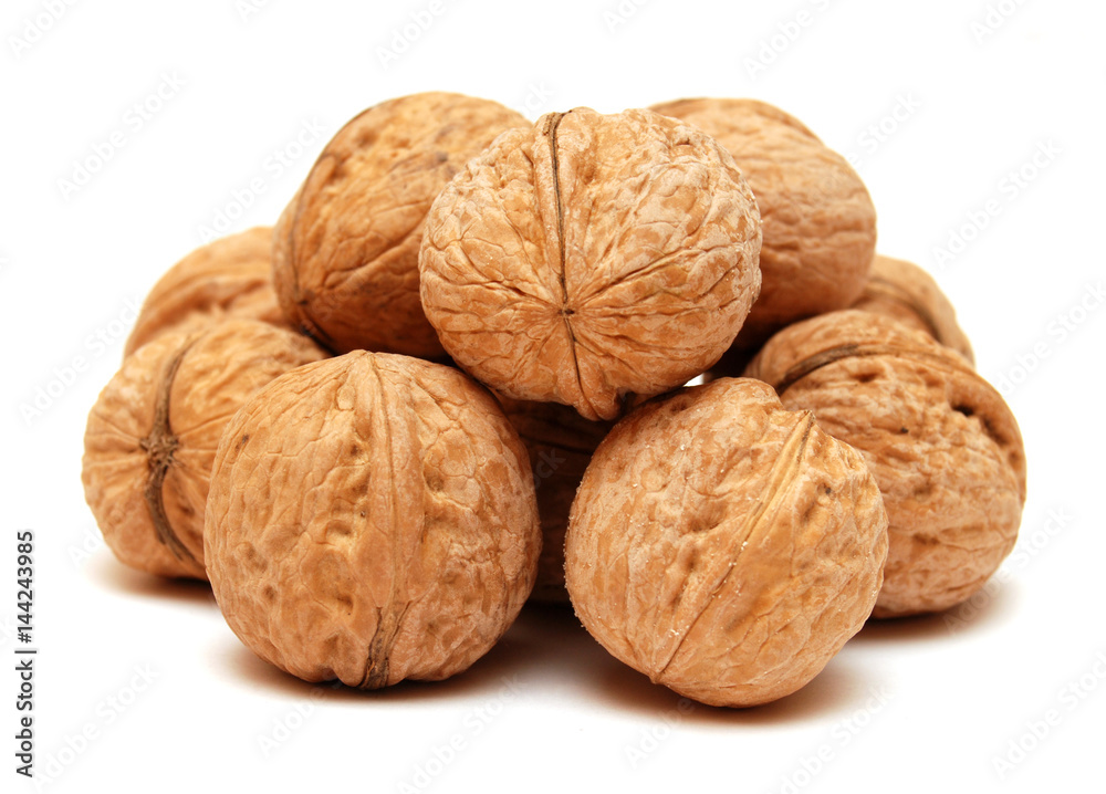 Dry walnuts in shell isolated on white background. Flat lay, top view Dry walnuts in shell isolated on white background. Flat lay, top view