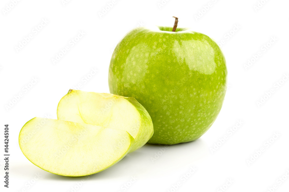 Juicy fresh green apple and apple slices on a white background Juicy fresh green apple and apple slices on a white background