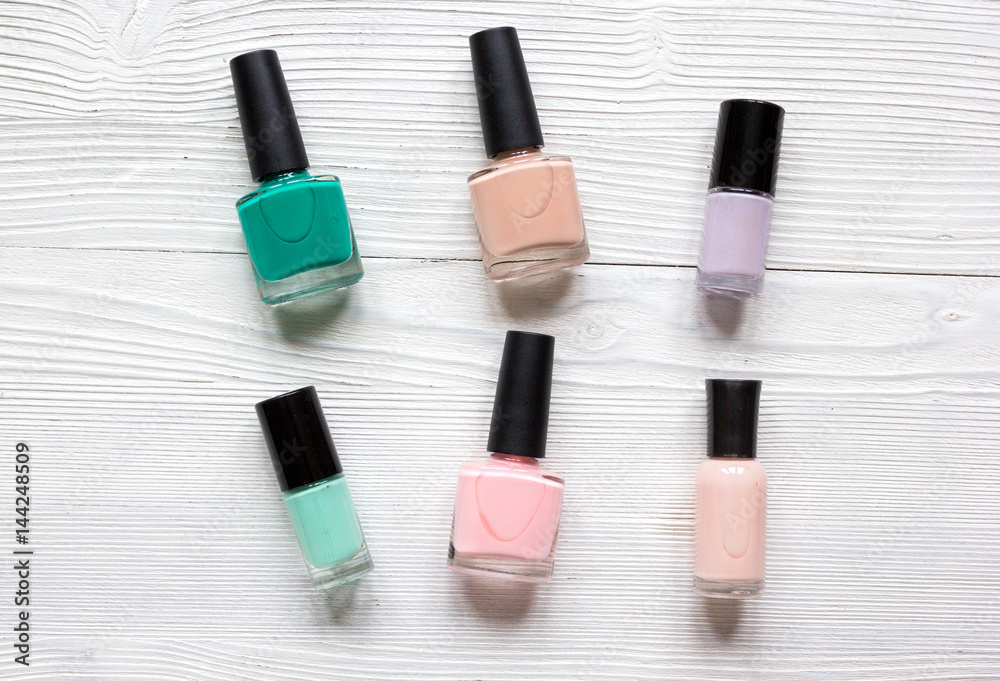 Close up of nail polish on white background top view Close up of nail polish on white background top view