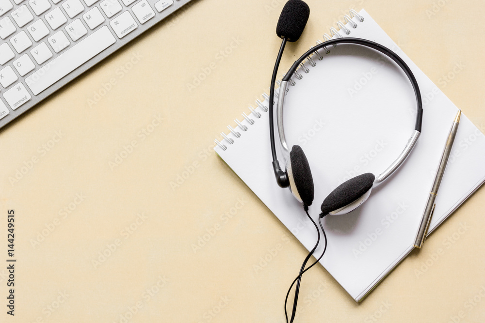 Office desk with headset and keyboard brown background top view mockup Office desk with headset and keyboard brown background top view mockup